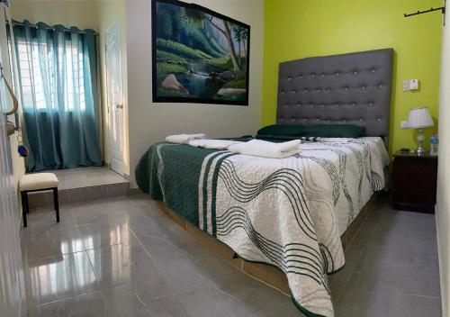 Postel nebo postele na pokoji v ubytování Hotel El Parque Constanza