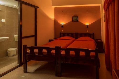מיטה או מיטות בחדר ב-Savas Rooms