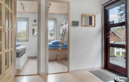 a room with a bunk bed and a doorway at Amazing Home In Dannemare With Kitchen in Dannemare