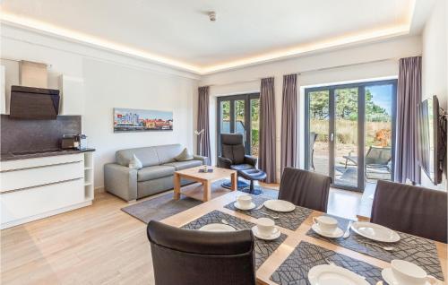 a living room with a dining table and a couch at Skipper in Binz