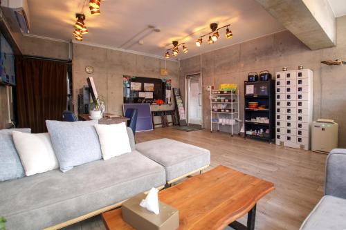 a living room with a couch and a table at Hotel Resort Inn Ishigakijima in Ishigaki Island