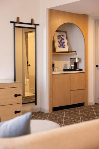 a room with a mirror and a counter at Omni Las Colinas Hotel in Irving