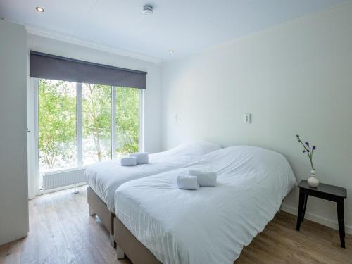 Ένα ή περισσότερα κρεβάτια σε δωμάτιο στο Beachfront Stay for Groups