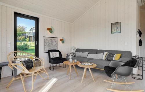 a living room with a couch and chairs and a table at Lovely Home In Allinge With Wifi in Allinge