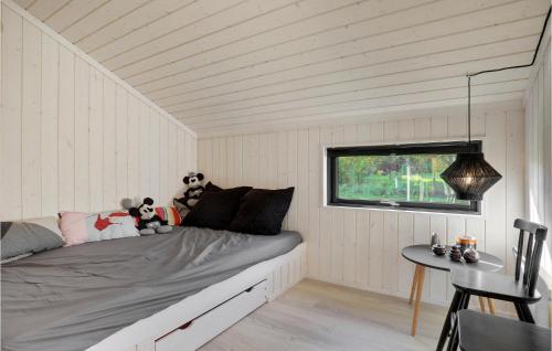a bedroom with a bed with two teddy bears on it at Lovely Home In Allinge With Wifi in Allinge