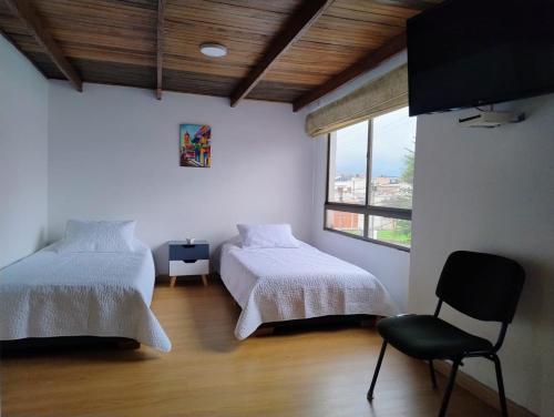 Postel nebo postele na pokoji v ubytování Casa Café & Orquídea - Hospedaje