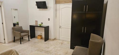 TV a/nebo společenská místnost v ubytování Nonó Hotel