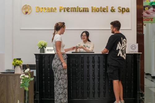 a group of people standing at a podium at Dream Premium Hotel & Spa in Hanoi