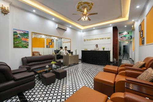 a waiting room with brown leather chairs and a counter at Dream Premium Hotel & Spa in Hanoi