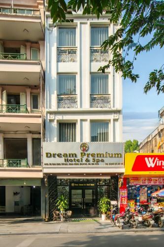 a white building with a sign in front of it at Dream Premium Hotel & Spa in Hanoi