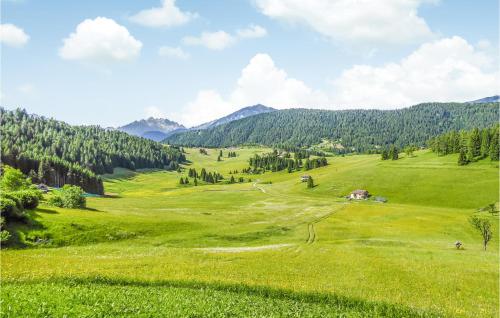 a green field with mountains in the background at Cozy Apartment In Vason With Kitchen in Vason