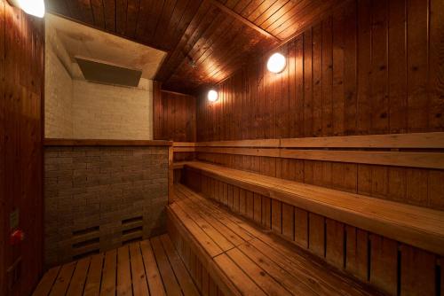 an empty wooden boiler room with wood floors and lights at Hotel Global View Hakodate in Hakodate