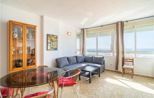 a living room with a couch and a glass table at Awesome Apartment In Málaga in Málaga