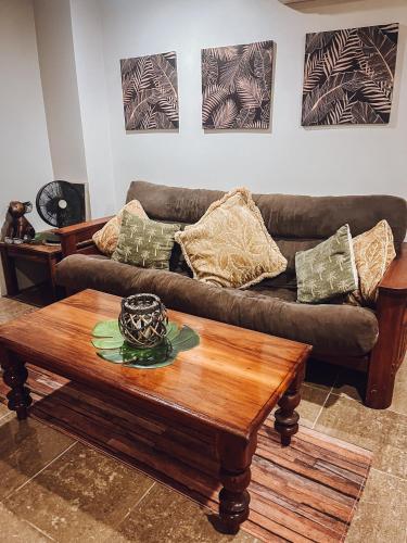 a living room with a couch and a coffee table at Whitsundays BNB Retreat in Airlie Beach