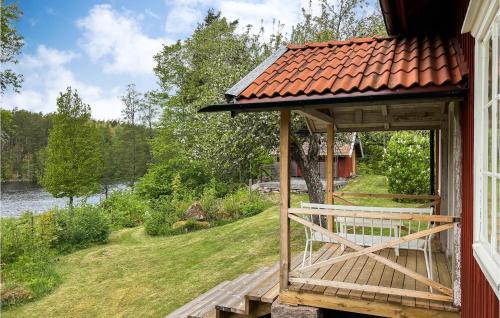 a gazebo on the side of a house at 2 Bedroom Amazing Home In Vimmerby in Vimmerby