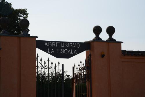 a sign that reads argentina la fiesta behind a fence at Tenuta La Fiscala in Alessandria