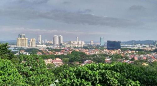 a view of a city with tall buildings and trees at Hotel Zamburger Bangsar (Previously Koptown Hotel Bangsar) in Kuala Lumpur