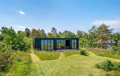 a glass house in the middle of a field at Stunning Home In Kalundborg With Wifi in Kalundborg