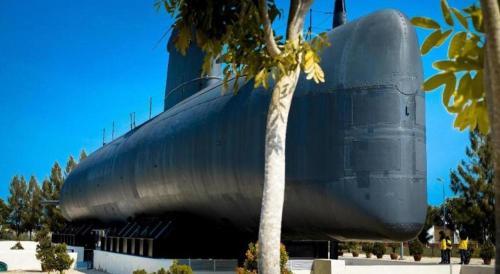 a large submarine sitting on display next to a palm tree at Hatten Place Melaka in Melaka