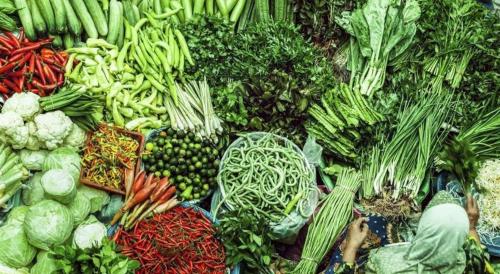 a pile of vegetables on display at a market at OYO 718 Mr J Hotel Wakaf Che Yeh 1 in Kota Bharu