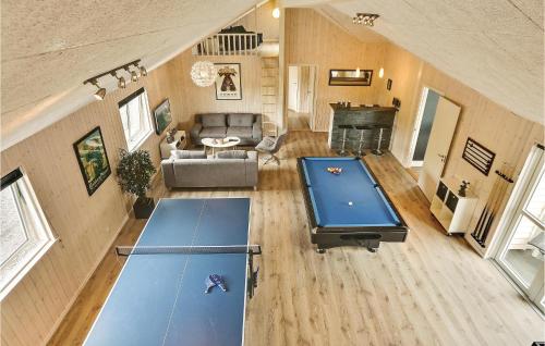 an overhead view of a living room with ping pong tables at Holiday Home Vejby With Fireplace 05 in Vejby