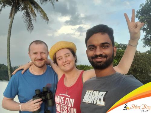 a group of three men posing for a picture at Shine Ray VILLA in Galle