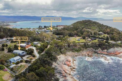 an aerial view of an island with a sign that reads legacy hill resort at Suntrap Cove - you and the ocean in Bicheno