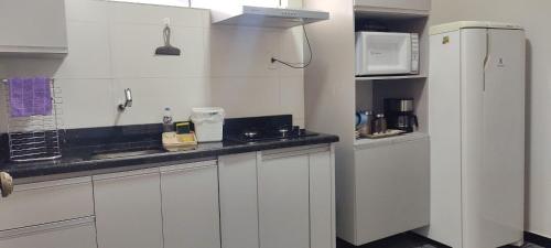 Η κουζίνα ή μικρή κουζίνα στο Apartamentos aconchegante Aki