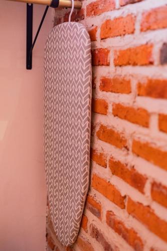 a skateboard hanging on a brick wall at Casa de hospedaje -La Abadía de San Pedro in Guadalajara