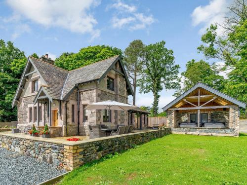 a large stone house with a stone wall at Herdwick View - Uk33668 in Bassenthwaite Lake