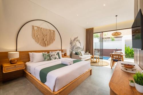 Ένα ή περισσότερα κρεβάτια σε δωμάτιο στο Cove Anantaha Loft & Villa