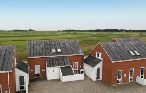 a group of houses with solar panels on their roofs at Lejlighed 190 in Rømø