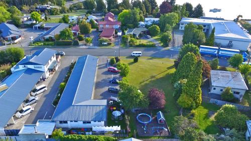 an aerial view of a small town with a parking lot at Aden Motel in Te Anau