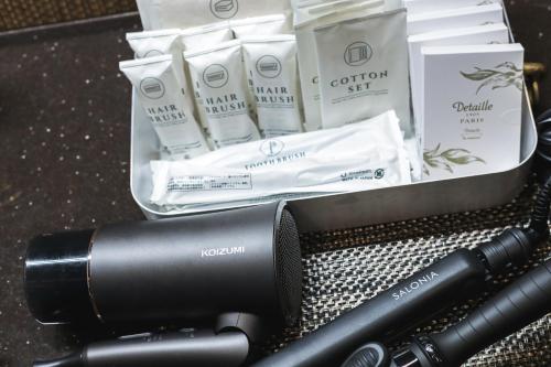 a camera and some products on a table at Sunrise Villa Oarai in Natsumi