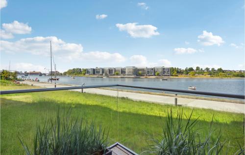 a view of a river with buildings in the background at 1 Bedroom Nice Apartment In Sønderborg in Sønderborg