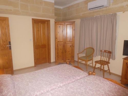 Кровать или кровати в номере San Antonio Guesthouse