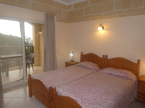 Кровать или кровати в номере San Antonio Guesthouse