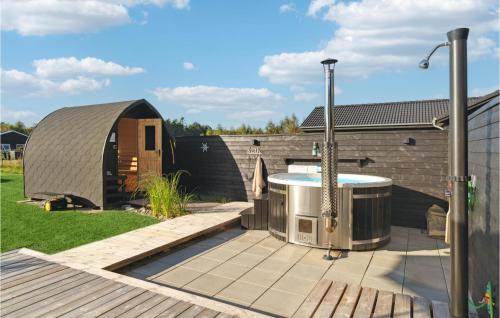 a backyard with a hot tub and a yurt at Amazing Home In Glesborg With Wifi in Glesborg