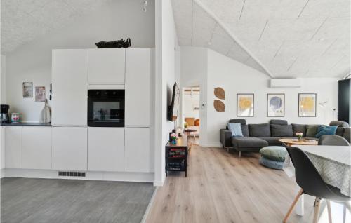a living room with a couch and a table at Amazing Home In Glesborg With Wifi in Glesborg