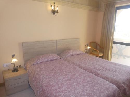 Кровать или кровати в номере San Antonio Guesthouse