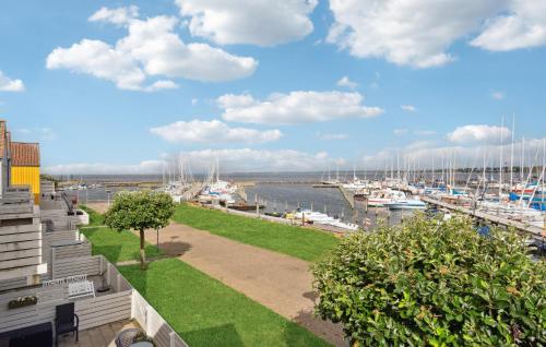 a view of a marina with boats in the water at Stunning Apartment In Rudkøbing in Rudkøbing