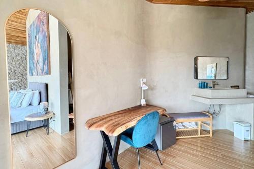 a room with a desk and a bed and a mirror at Villa Cefloralie - A Tranquil Retreat in Koh Samui in Koh Samui