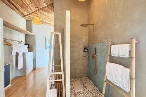 a bathroom with a ladder and a shower in a room at Villa Cefloralie - A Tranquil Retreat in Koh Samui in Koh Samui