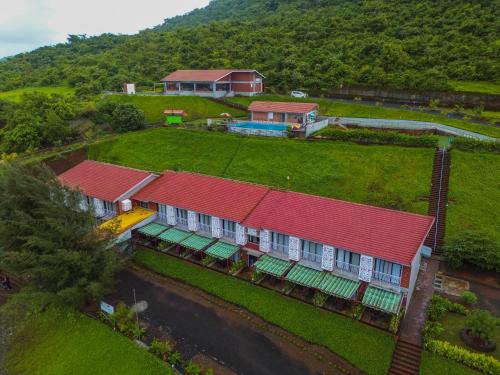 an aerial view of a house with red roof at Gaurav Lords Resort in Srīvardhan