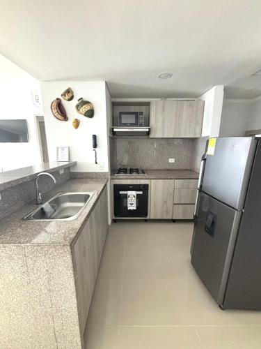 Kuchyň nebo kuchyňský kout v ubytování Apartamento de playa Ocean Drive