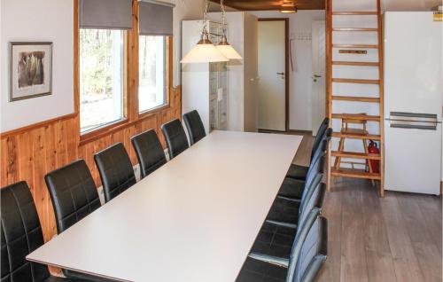 a conference room with a long table and chairs at Amazing Home In Köpingsvik With Sauna in Köpingsvik