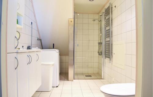 a bathroom with a shower and a toilet and a sink at Fjellstua C3, Leil 202 in Sjusjøen