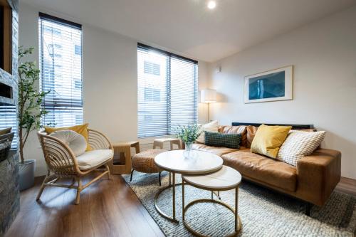 a living room with a couch and a table at Nakajima Nouveau in Sapporo