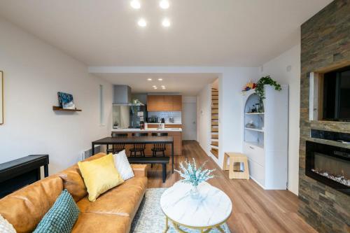 a living room with a couch and a table at Nakajima Nouveau in Sapporo
