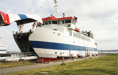 a large boat is parked in a field at Gorgeous Home In Sejerø With Wifi in Sejerby
